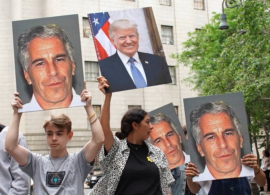 People hold up photos of Jeffrey Epstein and President Donald Trump while Billionaire Jeffrey Epstein awaits a bail hearing at Manhattan Federal Court after being arrested Saturday on sex-trafficking  ...