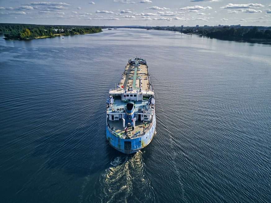 Oil tanker on Volga River against sky KNTF05535