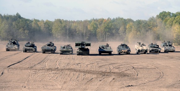 REFILE - ADDITIONAL INFORMATION Tanks and armoured fighting vehicles of the German army Bundeswehr take part in an exercise during a media day in Munster, Germany September 28, 2018. REUTERS/Fabian Bi ...