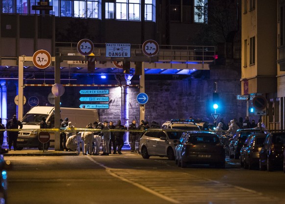 French police vehicles and officers stand near the site where Cherif Chekatt, the alleged gunman who had been on the run since allegedly killing three people at Strasbourg s popular Christmas market, ...