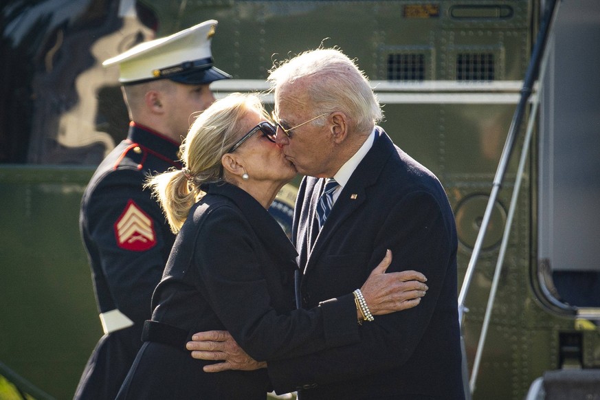 US President Joe Biden and First Lady Jill Biden kiss on the South Lawn of the White House after arriving on Marine One in Washington, DC, on Monday, November 13, 2023. Boeing may finally see a sales  ...