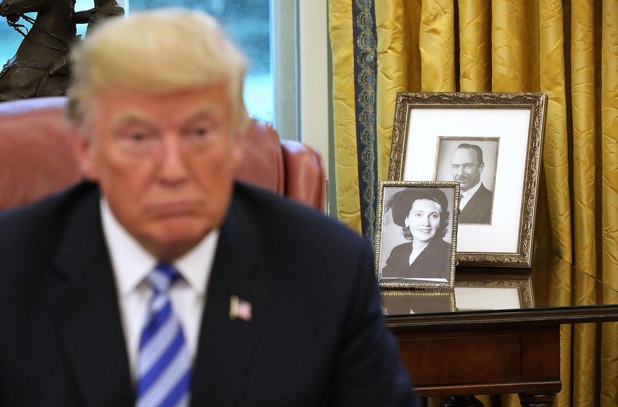 WASHINGTON, DC - AUGUST 28: Framed photographs of U.S. President Donald Trump's parents, Fred and Mary Trump, sit on a table in the Oval Office while the president meets with FIFA President Gianni Inf ...