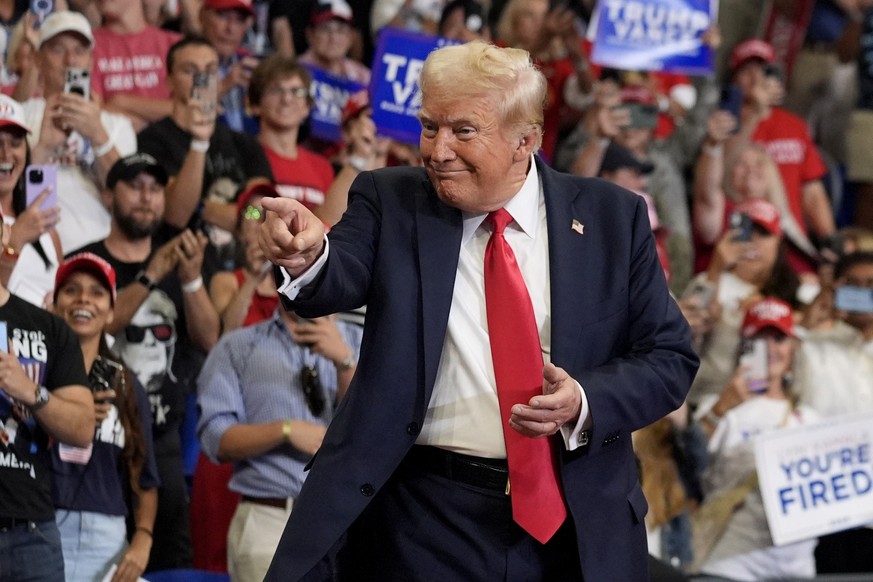 Republican presidential candidate former President Donald Trump gestures to the crowd as he arrives to speak at a campaign rally at Georgia State University in Atlanta, Saturday, Aug. 3, 2024. (AP Pho ...