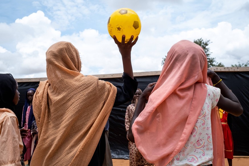 CHAD OUADDAI ABOUTENGUE REFUGEES CAMP Young chrildren girls playing volleyball playing at the espace ami denfant EAH , a mental health support operation run by the NGO Handicap International, at About ...