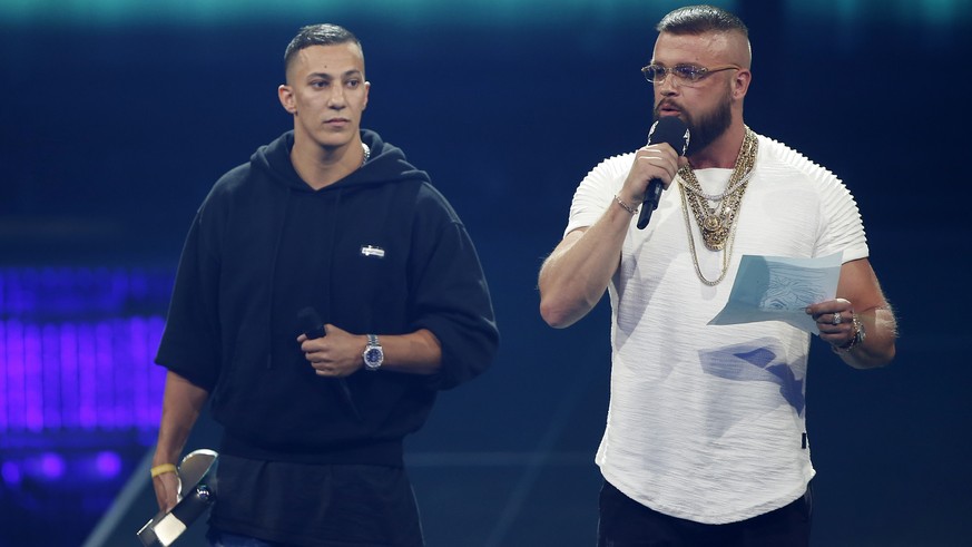 In this April 12, 2018 photo German rappers Kollegah &amp; Farid Bang receive the &quot;Hip-Hop/Urban national&quot; award during the 2018 Echo Music Awards ceremony in Berlin. A German Jewish leader  ...