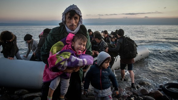 March 2, 2020, Skala Sikaminias, Lesvos Island, Greece: Refugees from Afghanistan arrive at the village of Skala Sikaminias, on the Greek island of Lesbos, after crossing on a dinghy the Aegean sea fr ...