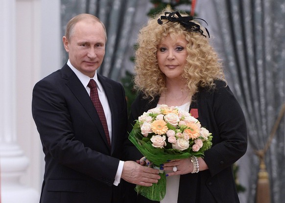 MOSCOW, RUSSIA. DECEMBER 22, 2014. Russian singer Alla Pugacheva receives an Order of Merit for the Fatherland (4th class) from Russia s president Vladimir Putin at a ceremony of presenting the state  ...