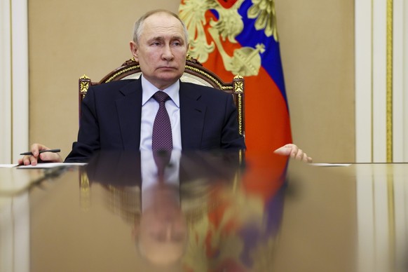 FILE - Russian President Vladimir Putin attends a ceremony to open new pharmaceutical production facilities in the Kaliningrad Region, Mordovia and St Petersburg via videoconference in Moscow, Russia, ...