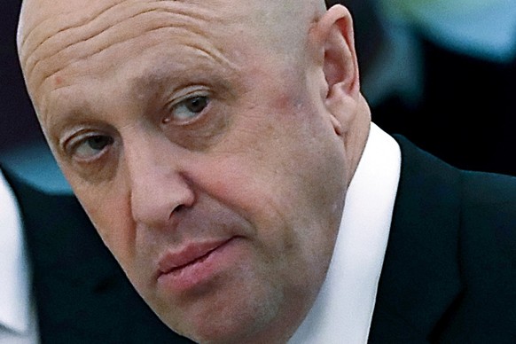 FILE - Russian businessman Yevgeny Prigozhin is shown prior to a meeting of Russian President Vladimir Putin and Chinese President Xi Jinping in the Kremlin in Moscow, Russia, July 4, 2017. The fighti ...