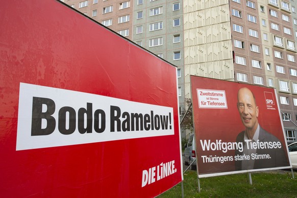 Campaign posters of the party Die Linke, left, and the Social Democratic Party, SPD, right, stand in front of a high-rise housing estate in Erfurt, Germany, Friday, Oct. 25, 2019. The words read: 'Bod ...