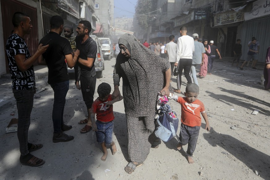 Palestinians evacuate wounded people following an Israeli airstrike in Bureij refugee camp, Gaza Strip, Thursday, Nov. 2, 2023. (AP Photo/Mohammed Dahman)