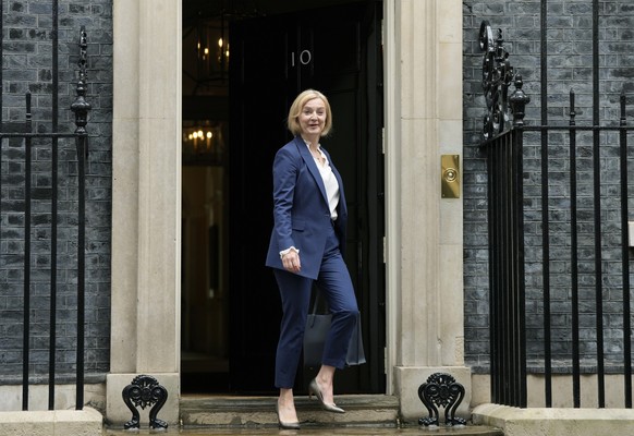 FILE - British Prime Minister Liz Truss leaves Downing Street to attend her first Prime Minister's Questions at the Houses of Parliament, in London, Wednesday, Sept. 7, 2022. Truss has only been in of ...