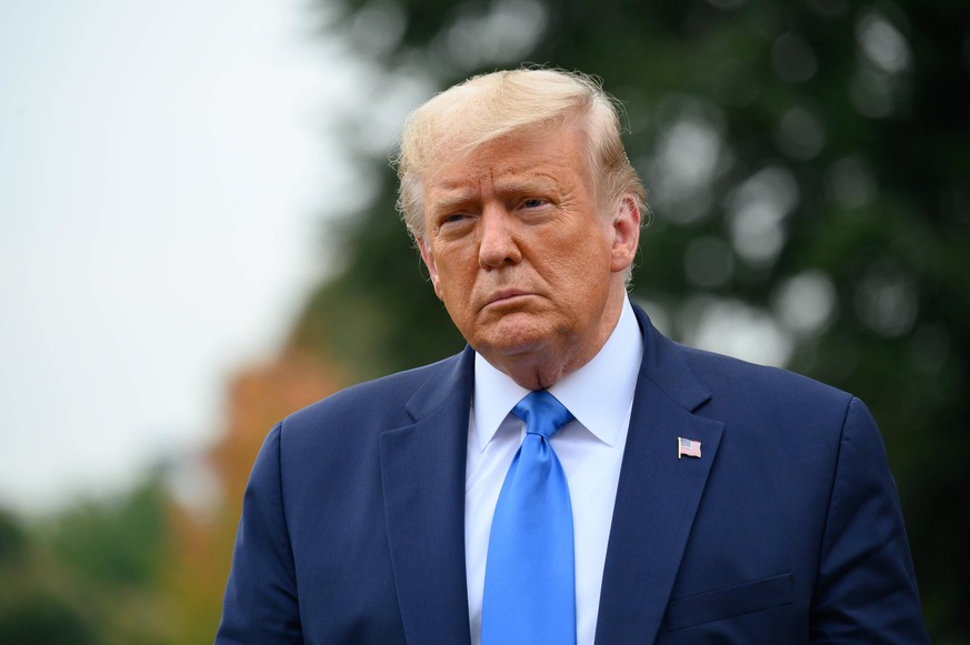 United States President Donald J. Trump speaks to members of the media on the South Lawn of the White House before boarding Marine One in Washington, D.C., U.S., on Thursday, September 24, 2020. Photo ...