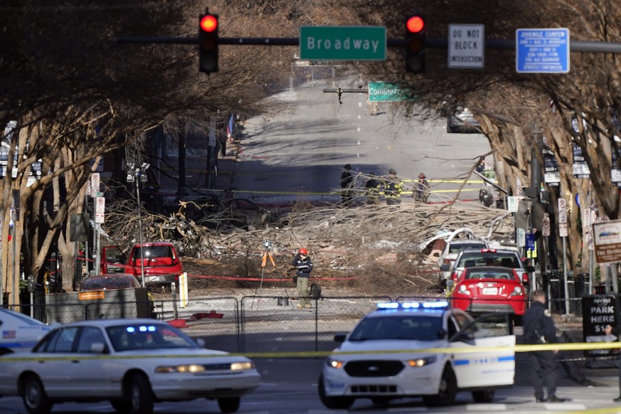 Investigators continue to examine the site of an explosion Sunday, Dec. 27, 2020, in downtown Nashville, Tenn. An explosion that shook the largely deserted streets of downtown Nashville early Christma ...