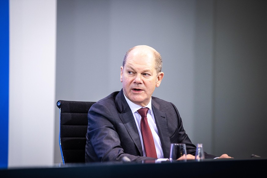 BERLIN, GERMANY - DECEMBER 13: Finance Minister Olaf Scholz speaks to the media about new, stricter lockdown measures following a meeting of federal and states government leaders on December 13, 2020  ...