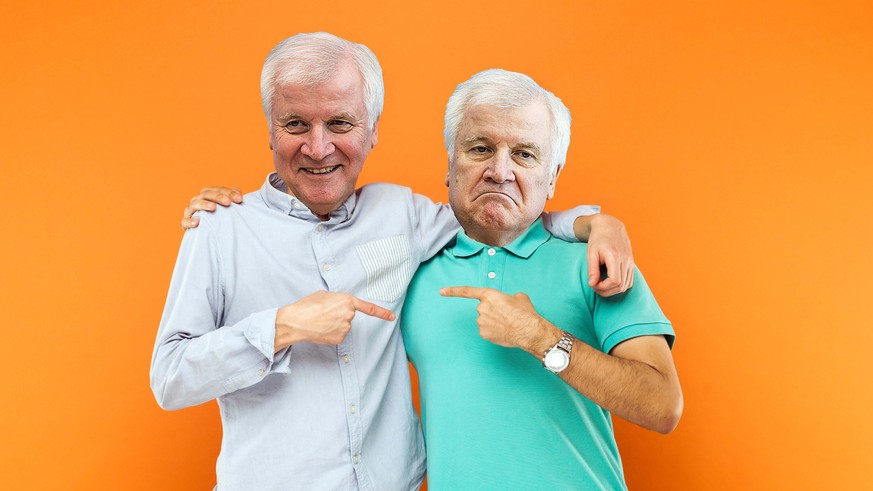 Two best friends hugging, pointing finger each other and looking at camera with shocked face. Studio shot on orange background