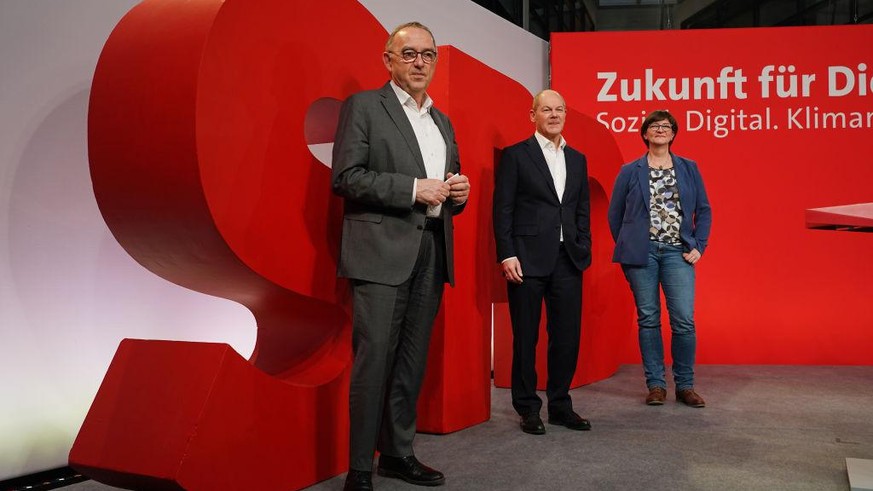 BERLIN, GERMANY - FEBRUARY 08: Olaf Scholz (C), chancellor candidate of the German Social Democrats (SPD), and SPD party co-leaders Norbert Walter-Borjans (L) and Saskia Esken pose for a photo after s ...