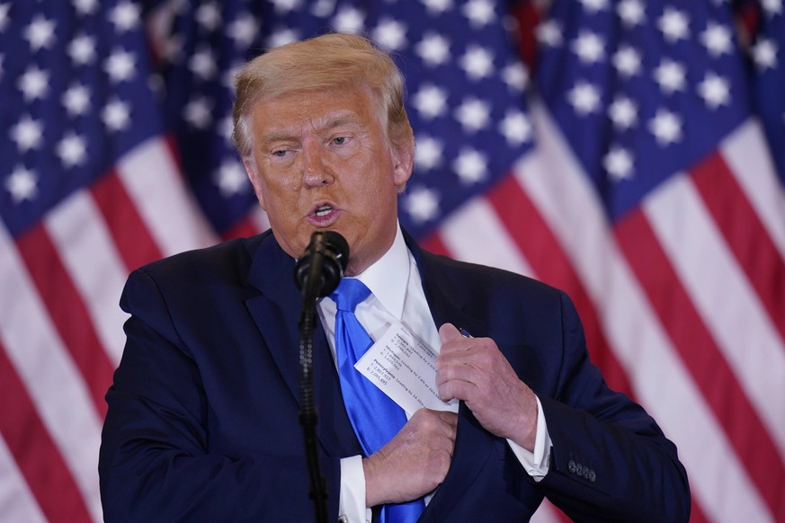 United States President Donald J. Trump makes a statement to the nation as his supporters look on in the East Room of the White House in Washington, DC on Election Night, Wednesday, November 4, 2020.. ...