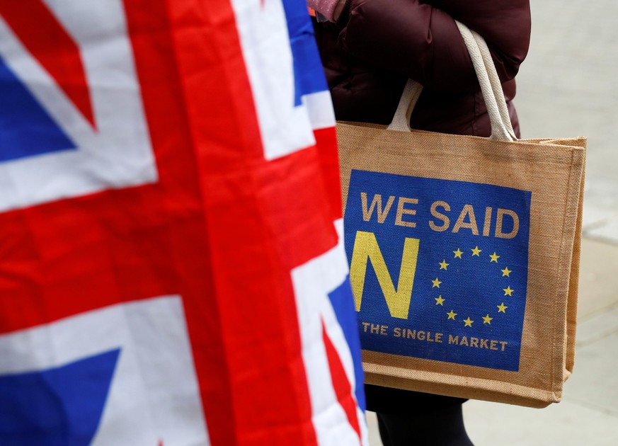 A Brexit supporter carries an anti-EU bag in London, Britain, December 10, 2018. REUTERS/Phil Noble