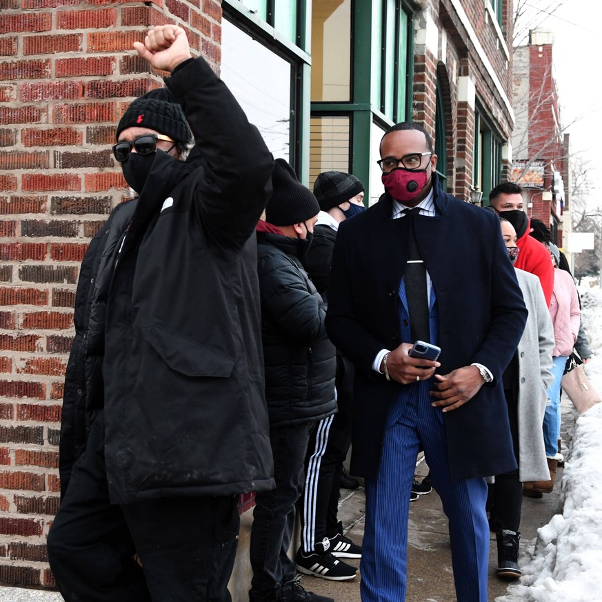 January 5, 2021, Kenosha, Wisconsin, USA: JUSTIN BLAKE, left, Jacob Blake s uncle, leads a family attorney, and Blake family supporters to a press conference in Kenosha, Wisconsin, after Kenosha Count ...