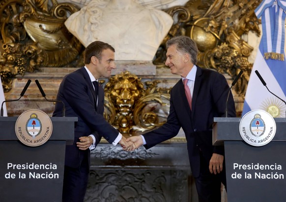 (181129) -- BUENOS AIRES, Nov. 29, 2018 -- Argentine President Mauricio Macri (R) shakes hands with French President Emmanuel Macron during a press conference in Buenos Aires, Argentina, Nov. 29, 2018 ...