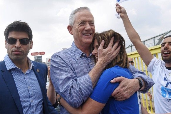 Benny Gantz, leader of the new Israeli Blue and White centrist party, hugs his wife, Revital, at a campaign stop at the mall in Kiryat Ekron, Israel, April 5, 2019. Gantz, a former chief of staff and  ...