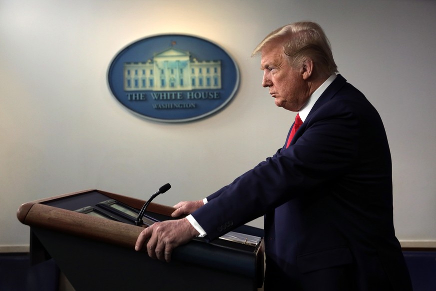 WASHINGTON, DC - MARCH 18: U.S. President Donald Trump pauses during a news briefing on the latest development of the coronavirus outbreak in the U.S. at the James Brady Press Briefing Room at the Whi ...