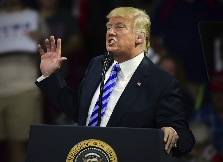 President Donald Trump speaks during a rally Tuesday, Aug. 21, 2018, at the Civic Center in Charleston W.Va. (AP Photo/Tyler Evert)