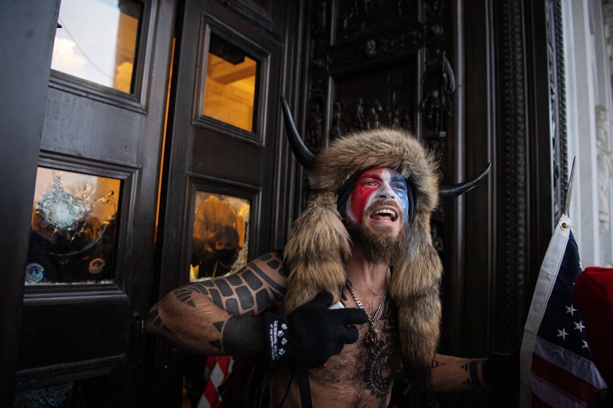 210106 A pro-Trump supporter outside the main entrance to the United States Capitol Building after it being stormed during a March to Save America Rally on January 6, 2021 in Washington, DC, USA. Phot ...