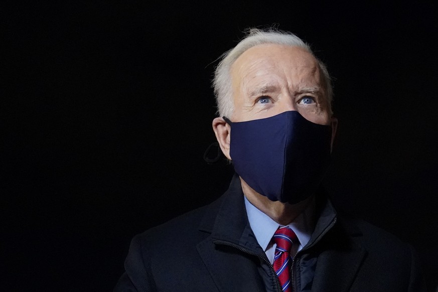 President Joe Biden speaks with reporters after stepping off Air Force One at New Castle Airport in New Castle, Del., Friday, Feb. 5, 2021. Biden is spending the weekend at his home in Delaware. (AP P ...