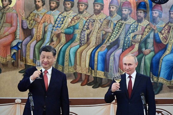 FILE - Russian President Vladimir Putin, right, and Chinese President Xi Jinping toast during their dinner at The Palace of the Facets in the Moscow Kremlin, Russia, March 21, 2023. Russian threats to ...