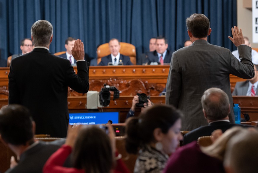 George Kent, the Deputy Assistant Secretary of State for European and Eurasian affairs (L) and William Taylor, the acting Ambassador to Ukraine (R), arrive to testify during the House House Intelligen ...