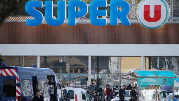 A general view shows gendarmes and police officers at a supermarket after a hostage situation in Trebes, France, March 23, 2018. REUTERS/Regis Duvignau