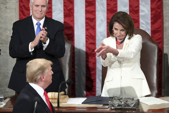 FILE - President Donald Trump turns to House Speaker Nancy Pelosi of Calif., as he delivers his State of the Union address on Capitol Hill in Washington, as Vice President Mike Pence watches, Feb. 5,  ...