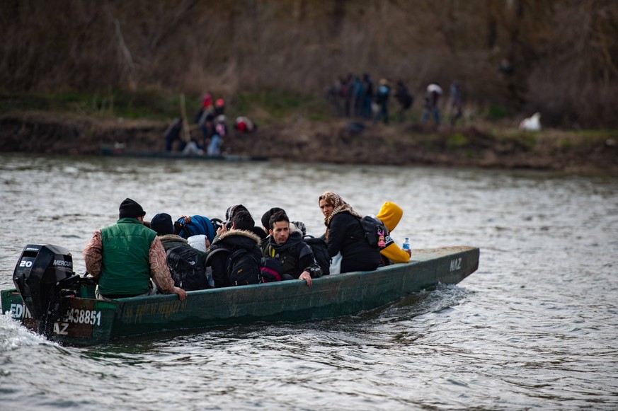 200301 -- ISTANBUL, March 1, 2020 Xinhua -- Illegal migrants cross the Meric river by boat to enter Greece in Edirne Province, Turkey, on March 1, 2020. Over 80,000 illegal migrants have so far crosse ...