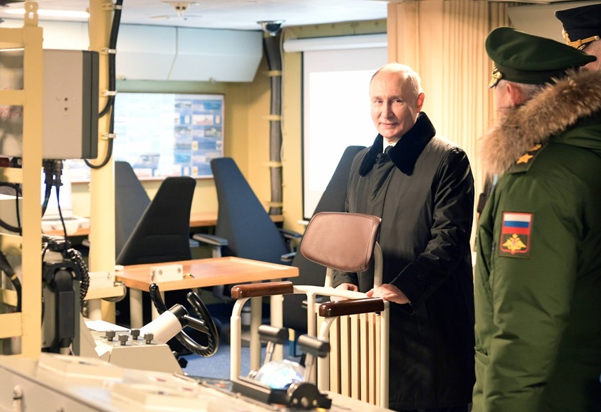 Russia Putin Northwestern Federal District 8589311 25.12.2023 Russian President Vladimir Putin visits the command post of the Admiral Golovko as the ship joins the Russian Northern Fleet, at the Sever ...