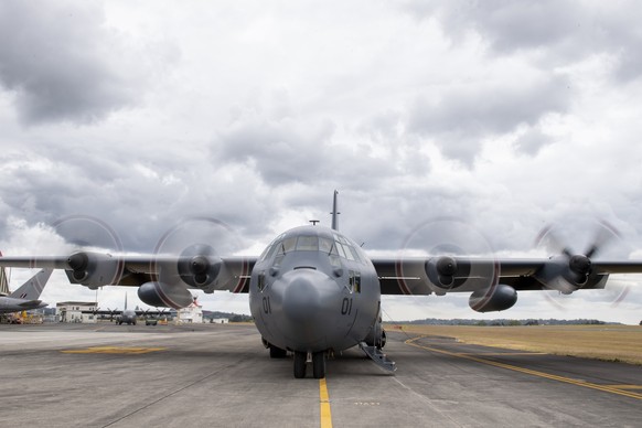 In this photo provided by the New Zealand Defence Force, a Royal New Zealand Air Force C-130 Hercules prepares to leaves an airbase in Auckland, Thursday, Jan. 20, 2022, flying to Tonga with aid. The  ...