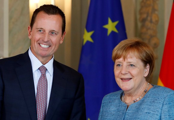 FILE PHOTO: German Chancellor Angela Merkel receives the ambassador of U.S. to Germany, Richard Grenell, in Meseberg, Germany July 6, 2018. REUTERS/Axel Schmidt/File Photo