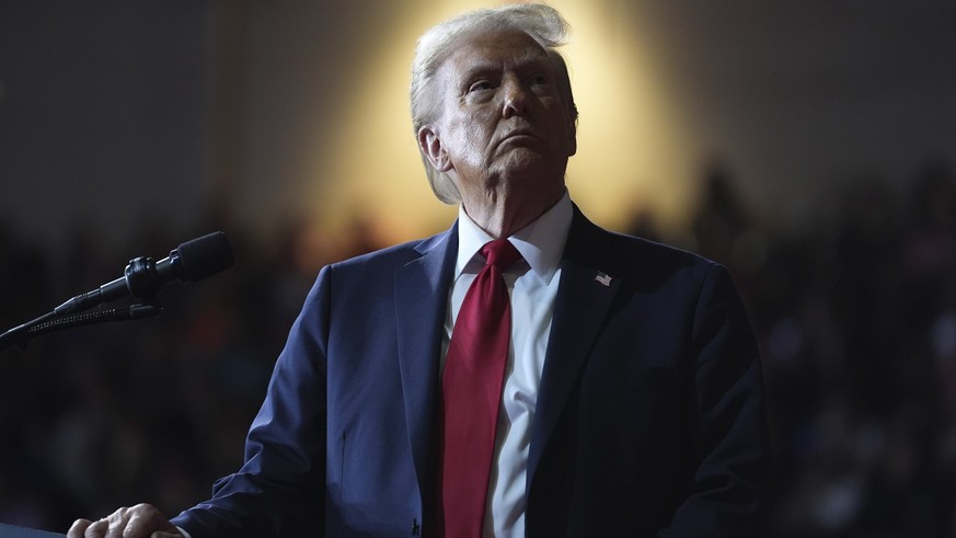 Republican presidential nominee former President Donald Trump watches a video screen at a campaign rally at the Salem Civic Center, Saturday, Nov. 2, 2024, in Salem, Va. (AP Photo/Evan Vucci)