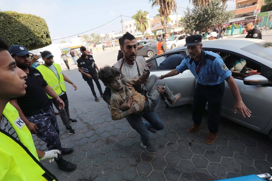 Palestinian paramedics treat wounded Palestinians, including children, at Al-Aqsa Hospital Palestinian paramedics treat wounded Palestinians, including children, at Al-Aqsa Hospital in the city of Dei ...