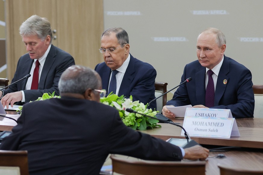 RUSSIA, ST PETERSBURG - JULY 28, 2023: Russia s President Vladimir Putin, Russia s Minister of Foreign Affairs Sergei Lavrov, and President Putins spokesman Dmitry Peskov R-L during a meeting with Pre ...