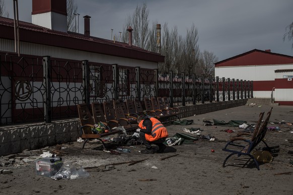 KRAMATORSK, UKRAINE - APRIL 09: Some volunteers look for traces to help identify the corpses at Kramatorsk railway station after the missile attack in Kramatorsk, Ukraine on April 09, 2022. Andrea Car ...