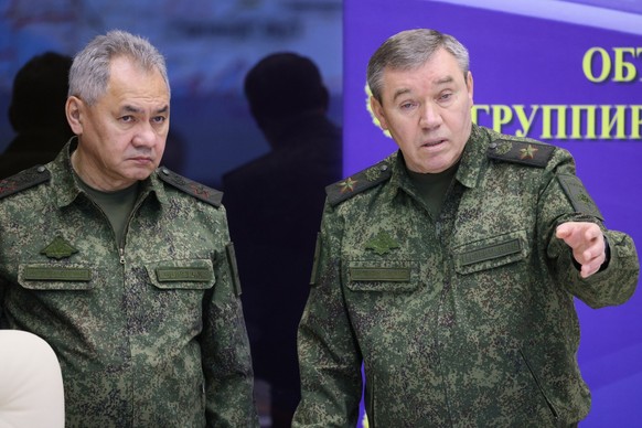 FILE - Russian Defense Minister Sergei Shoigu, left, and Chief of the Russian General Staff Valery Gerasimov attend the meeting with Russian President Vladimir Putin during his visit to the joint staf ...