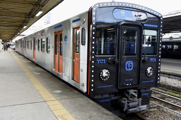 Kyushu Railway Co.'s new YC1 hybrid diesel-electric train leaves JR Nagasaki Station in the southwestern Japan city of Nagasaki on March 14, 2020. The train, which links Nagasaki and Sasebo stations,  ...