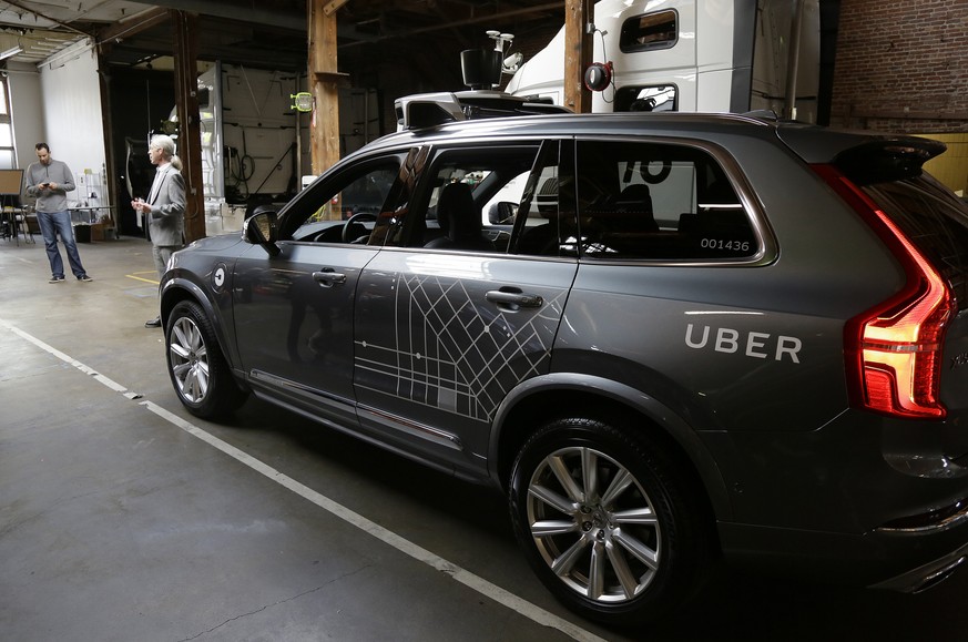 FILE - In this Dec. 13, 2016 file photo, an Uber driverless car is displayed in a garage in San Francisco. Uber suspended all of its self-driving testing Monday, March 19, 2018, after what is believed ...