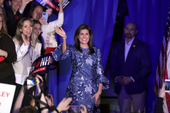 Republican presidential candidate former UN Ambassador Nikki Haley waves to the audience as she takes the stage to speak at a New Hampshire primary night rally, in Concord, N.H., Tuesday Jan. 23, 2024 ...