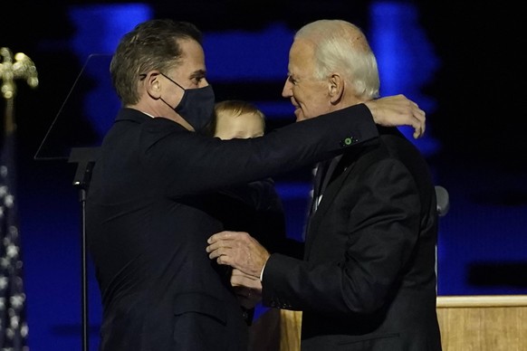 President-elect Joe Biden, right, embraces his son Hunter Biden at an event held outside of the Chase Center Saturday, November 7, 2020, in Wilmington, Delaware. Biden defeated President Donald Trump  ...