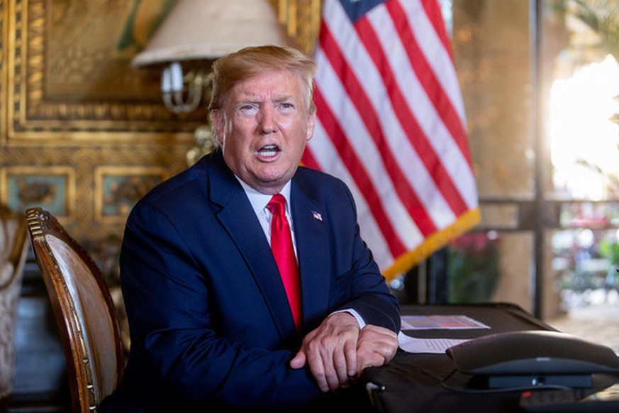 President Donald Trump speaks to the media after making a Christmas eve video conference call to members of the armed forces from Mar-a-Lago in Palm Beach, FL on Tuesday December 24, 2019. (RICHARD GR ...