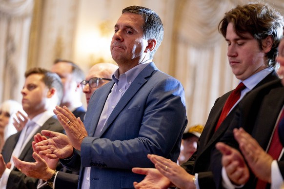 Former Rep. Devin Nunes, R-Calif., applauds in the audience as former President Donald Trump announces he is running for president for the third time as he speaks at Mar-a-Lago in Palm Beach, Fla., Tu ...