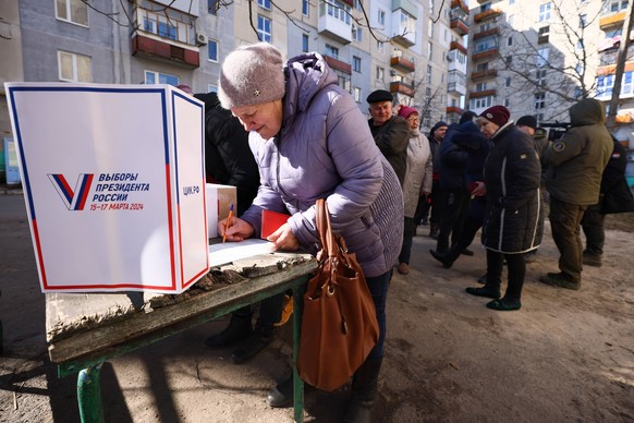 RUSSIA, LISICHANSK - MARCH 12, 2024: A woman takes part in an early voting in the 2024 Russian presidential election in Lisichansk. The election is scheduled for March 15-17, with LDPR Leader Leonid S ...